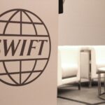 Inside the high-stakes battle between digital dollars and Swift’s massive money engine